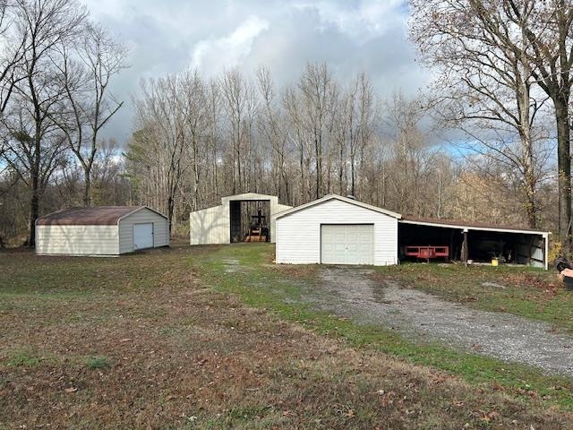 7030 Asbury Glimp Road Ripley, TN 38063 - Photo 7 of 22 Garage featuring a detached garage and driveway