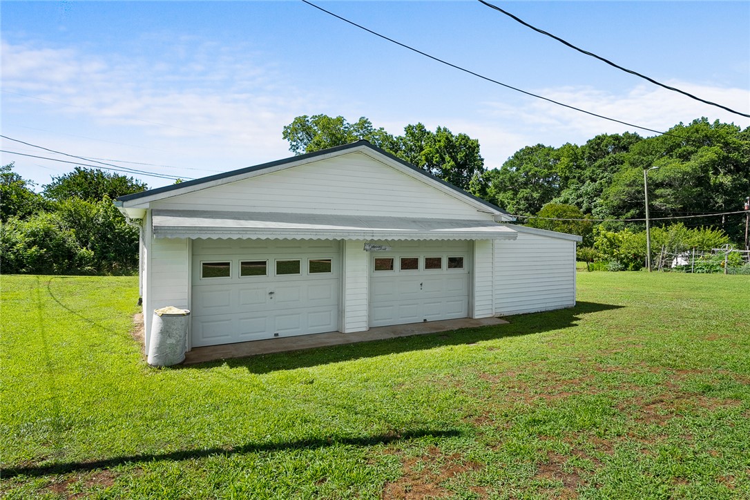 312 Edwards Drive Anderson, SC 29626 - Photo 28 of 44 A spacious detached garage offers ample storage and convenient vehicle accommodation on a verdant lot.
