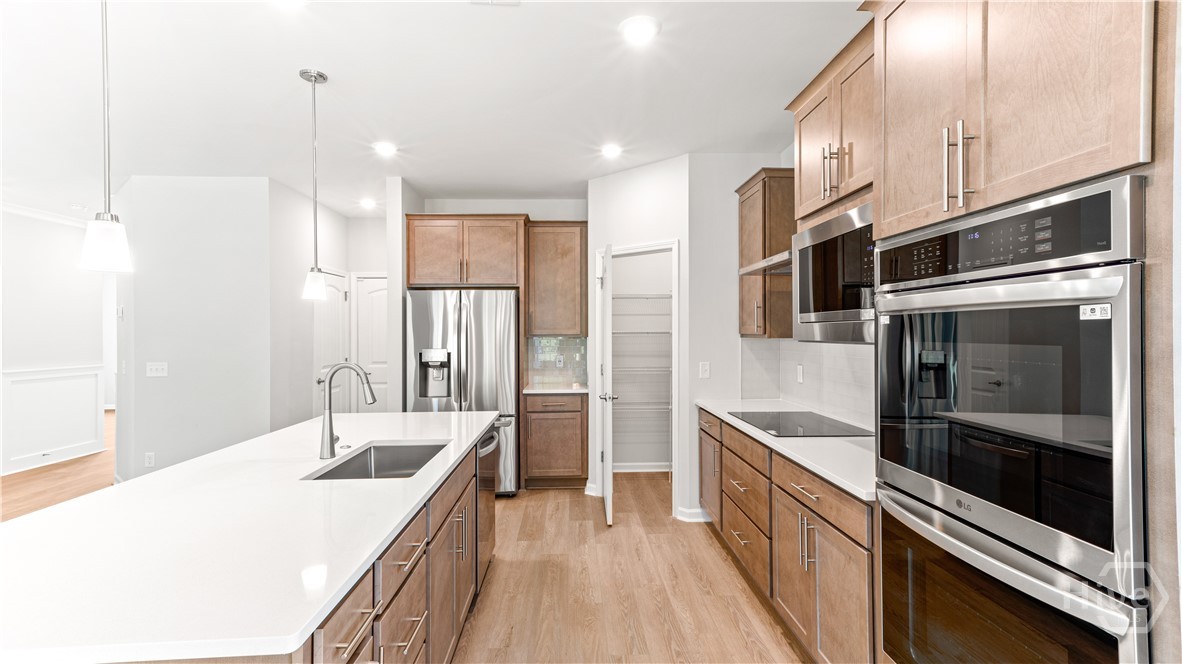 148 Como Drive Pooler, GA 31322 - Photo 11 of 41 Beautiful kitchen with quartz countertops and gourmet kitchen appliances including a double oven w/ a built-in air fryer!