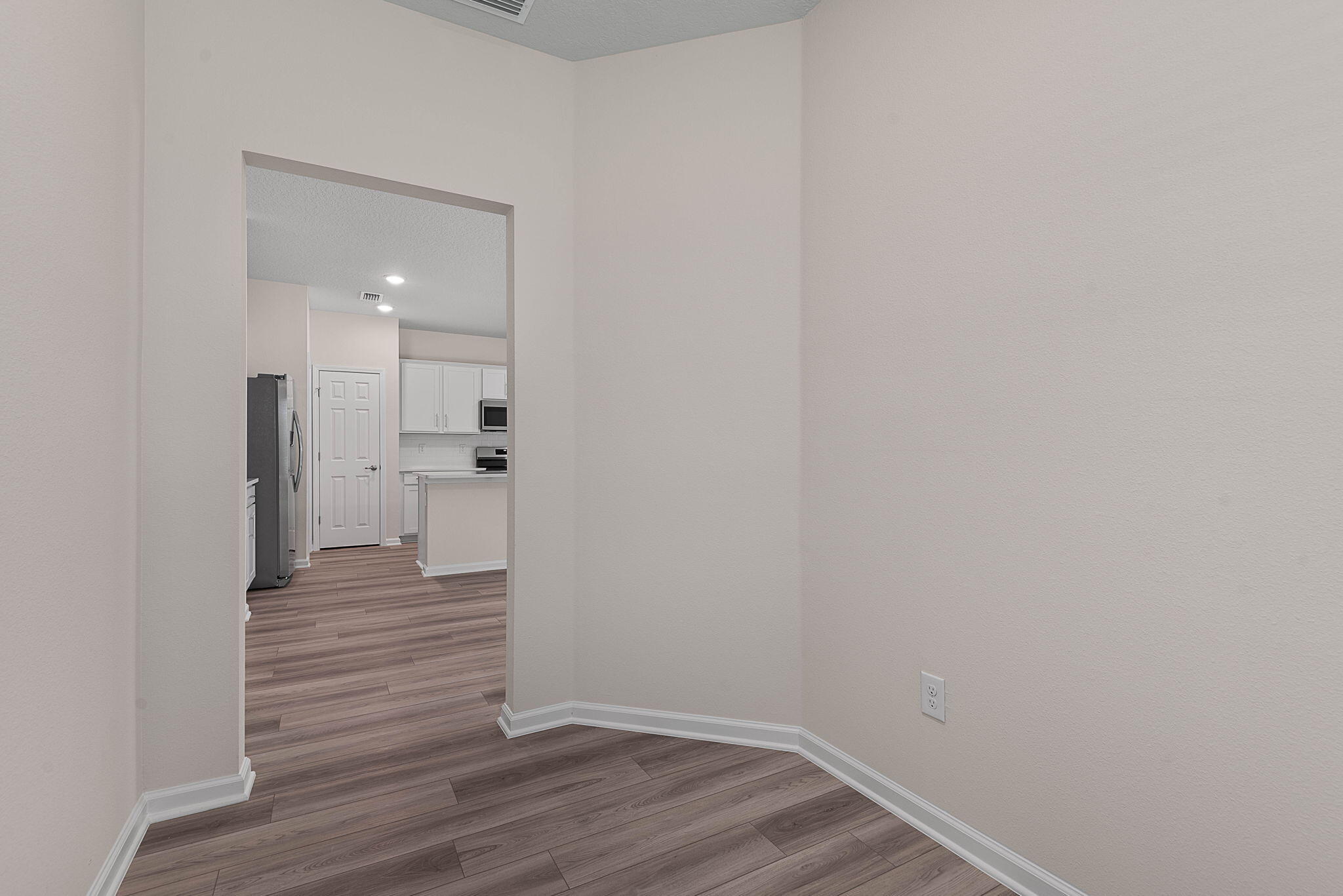 46 Poplar Drive Palm Coast, FL 32164 - Photo 14 of 59 a view of a hallway with wooden floor