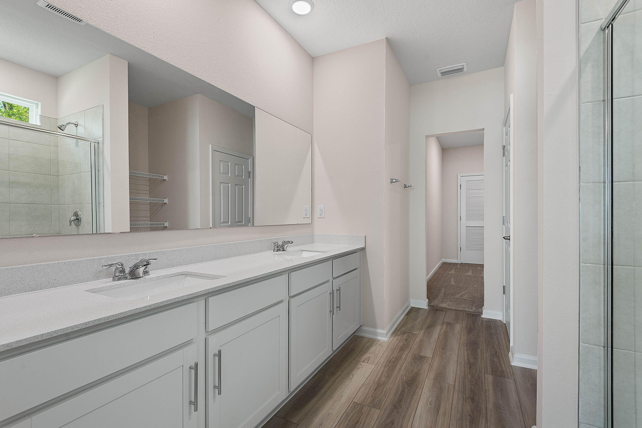 46 Poplar Drive Palm Coast, FL 32164 - Photo 31 of 59 a bathroom with a double vanity sink and mirror