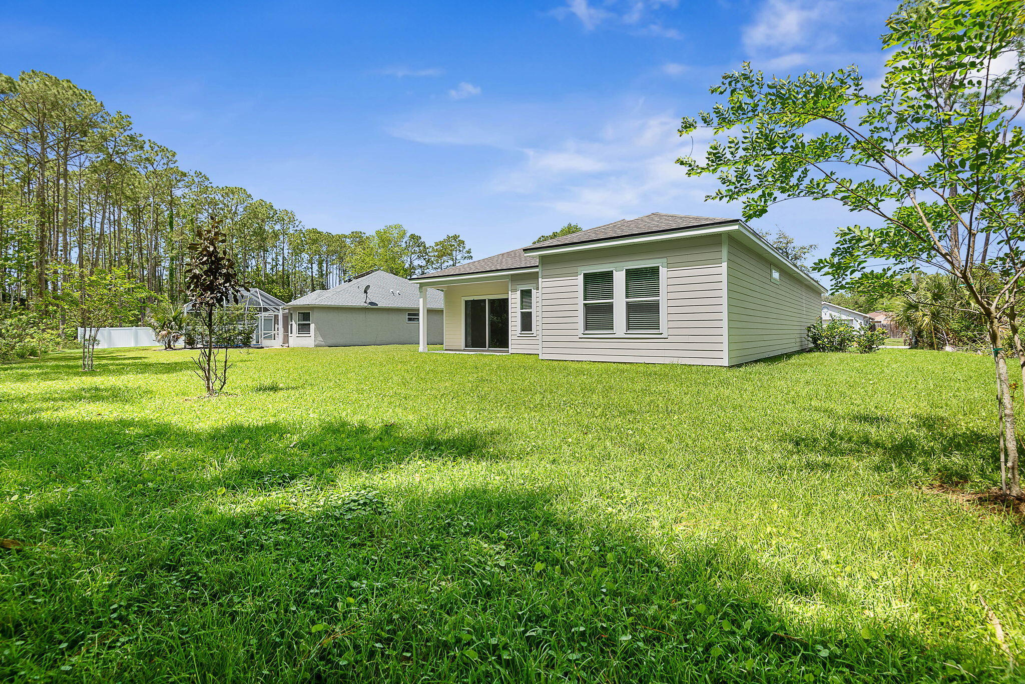 46 Poplar Drive Palm Coast, FL 32164 - Photo 46 of 59 a view of a house with a yard