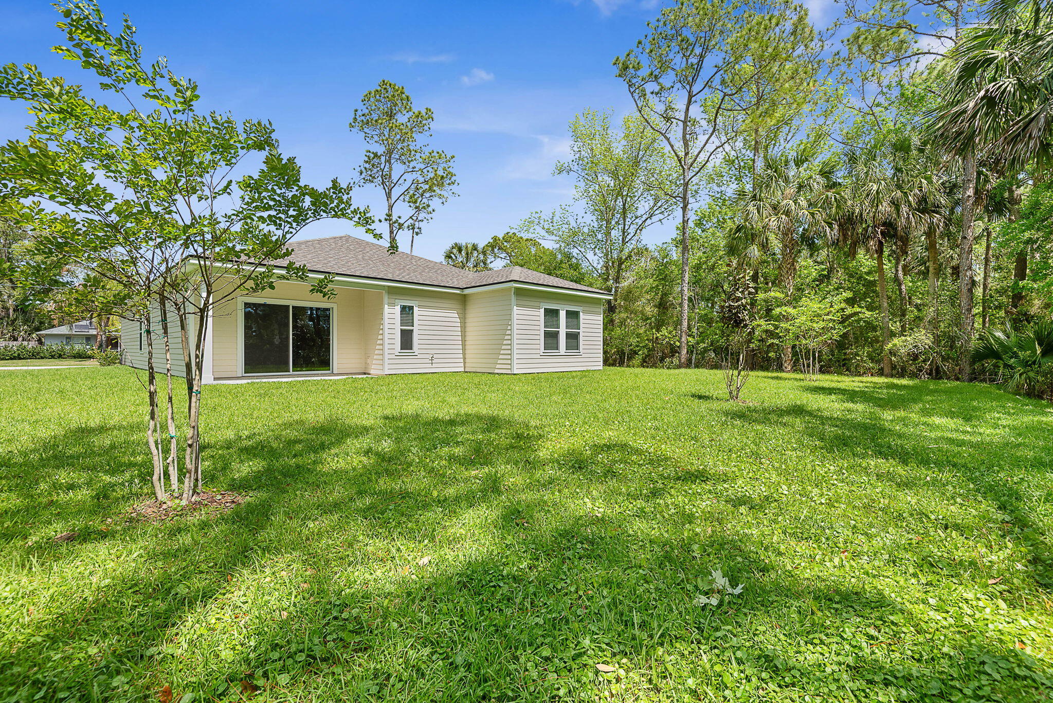 46 Poplar Drive Palm Coast, FL 32164 - Photo 47 of 59 a view of a house with a backyard