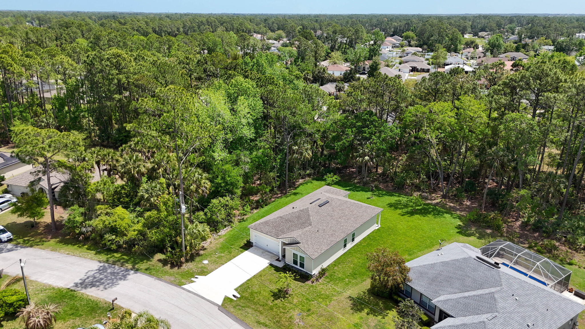 46 Poplar Drive Palm Coast, FL 32164 - Photo 57 of 59 an aerial view of a house with a yard