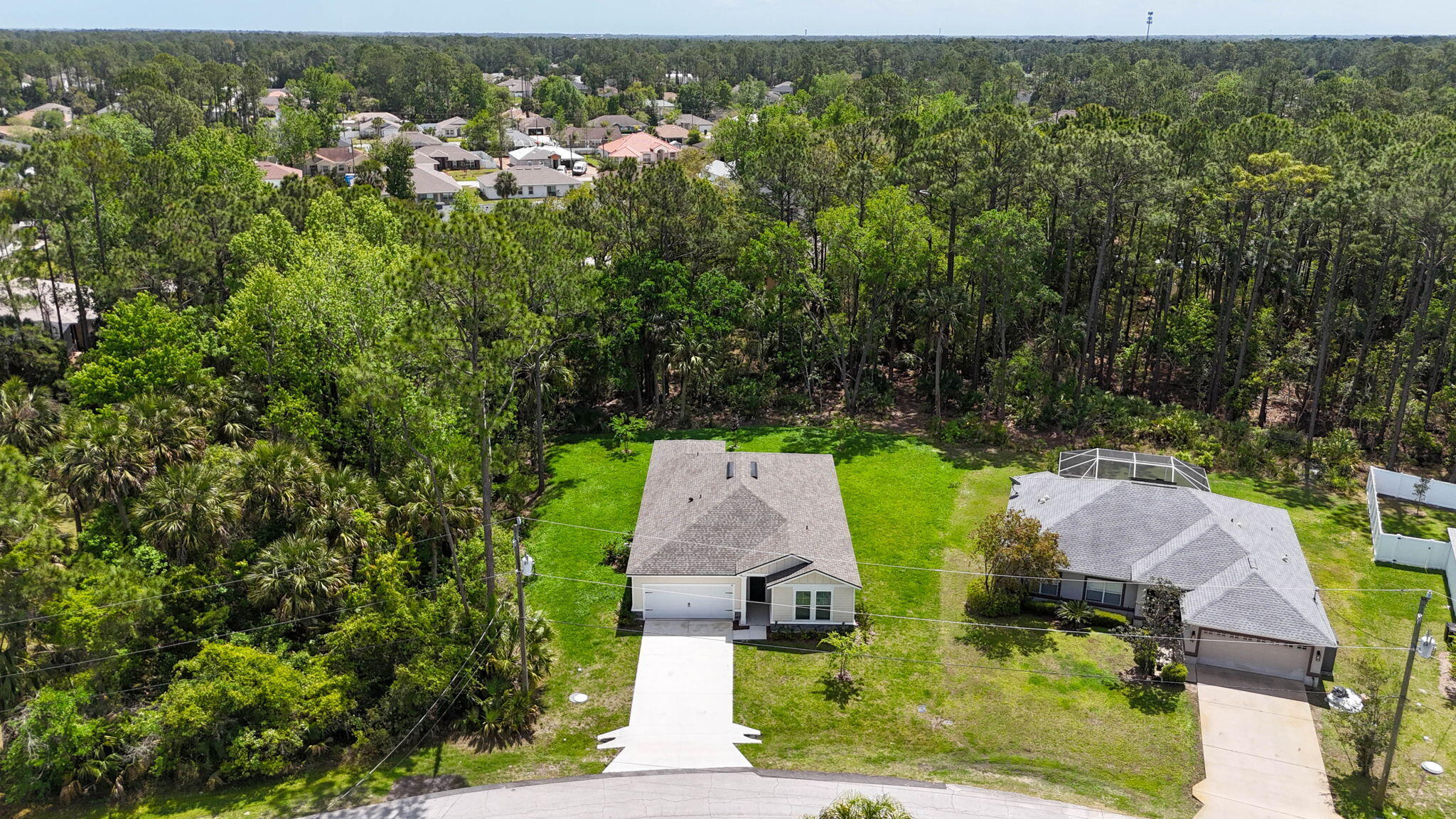 46 Poplar Drive Palm Coast, FL 32164 - Photo 58 of 59 an aerial view of residential house with outdoor space and trees all around