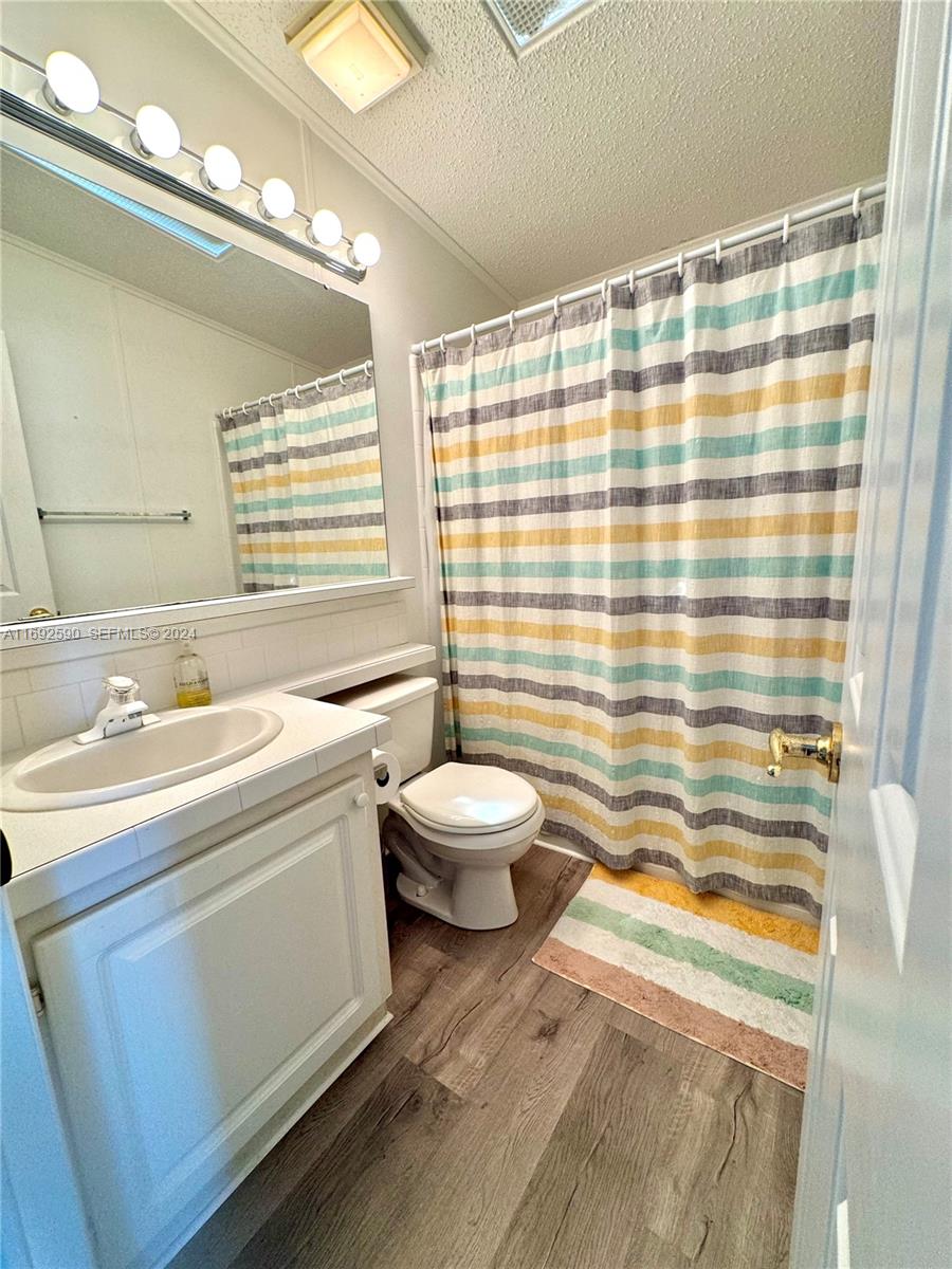 72 Ocean Drive Key Largo, FL 33037 - Photo 15 of 36 a bathroom with a sink toilet and shower