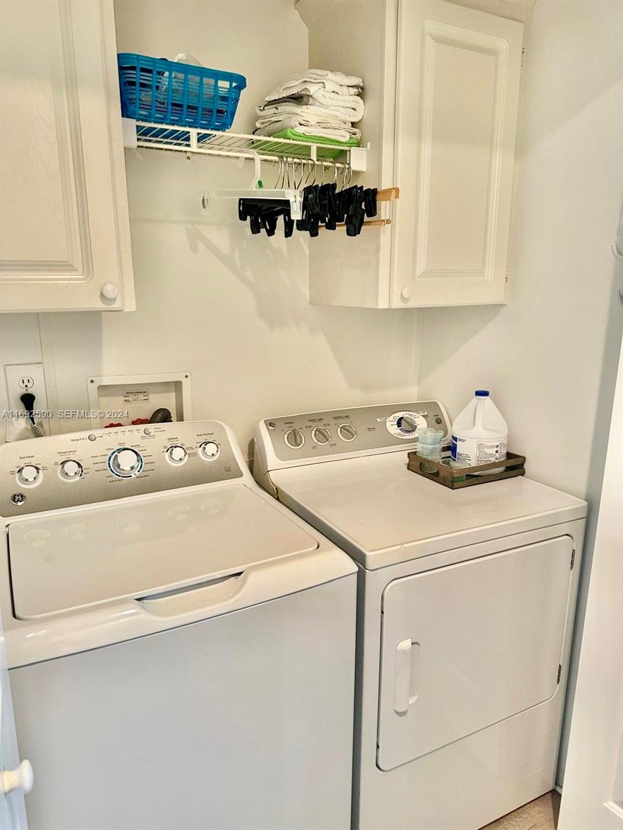 72 Ocean Drive Key Largo, FL 33037 - Photo 17 of 36 a utility room with dryer and washer