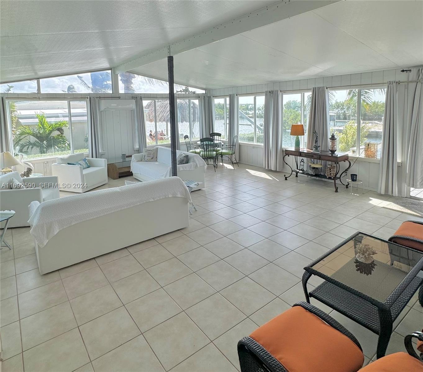 72 Ocean Drive Key Largo, FL 33037 - Photo 29 of 36 a living room with furniture and large windows