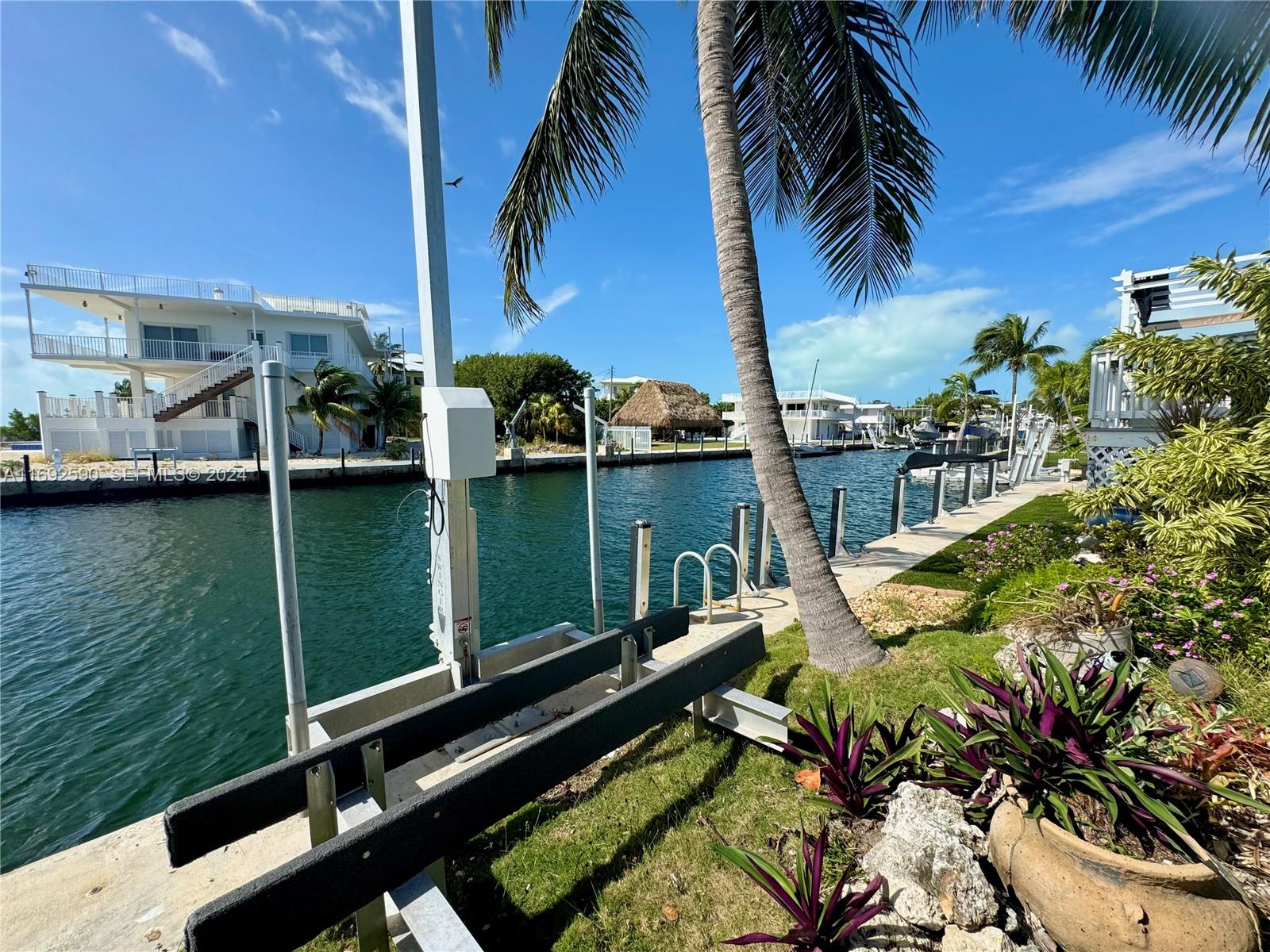 72 Ocean Drive Key Largo, FL 33037 - Photo 34 of 36 a view of swimming pool with a patio and a garden