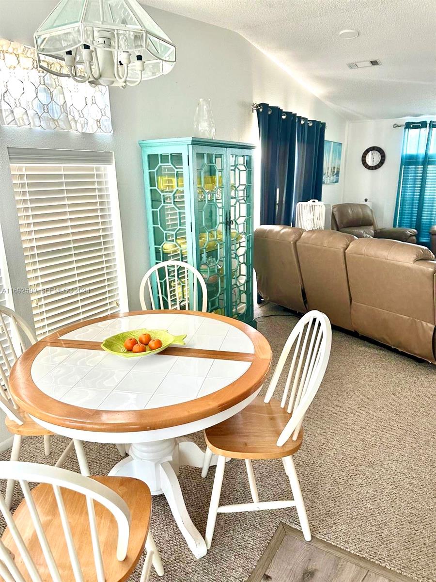 72 Ocean Drive Key Largo, FL 33037 - Photo 6 of 36 a bedroom with furniture and a large window