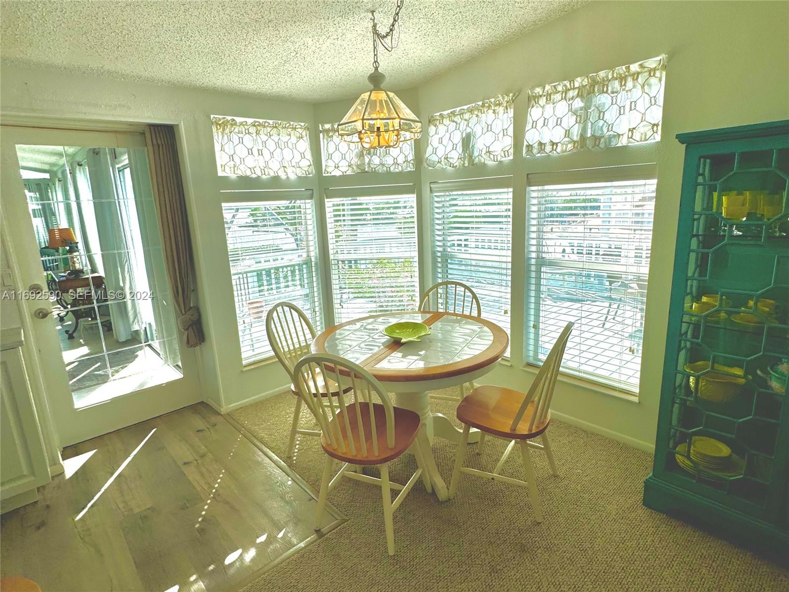 72 Ocean Drive Key Largo, FL 33037 - Photo 7 of 36 a view of a dining room with furniture window and outside view