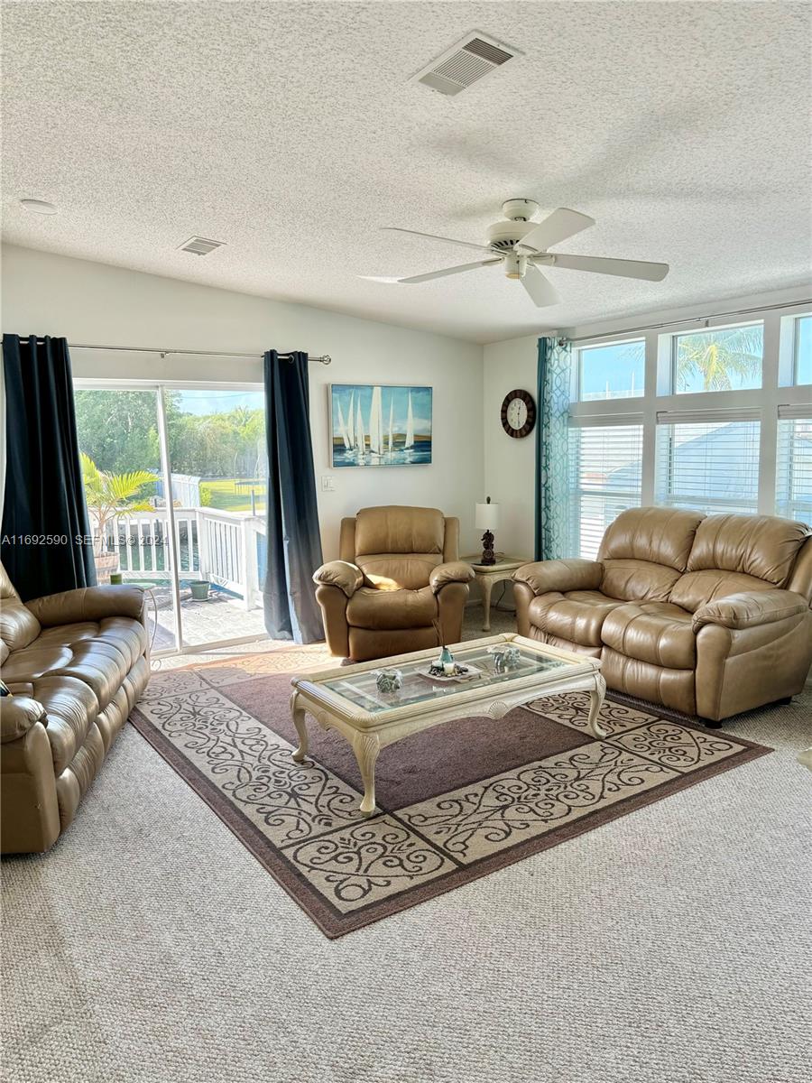 72 Ocean Drive Key Largo, FL 33037 - Photo 8 of 36 a living room with furniture and a large window