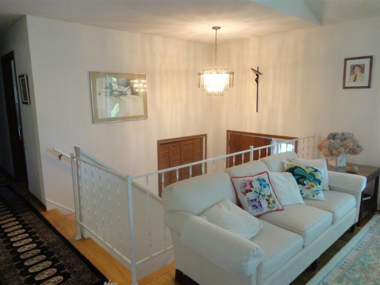 131 Old Kings Road Cotuit, MA 02635 - Photo 11 of 33 a living room with furniture and a wooden floor