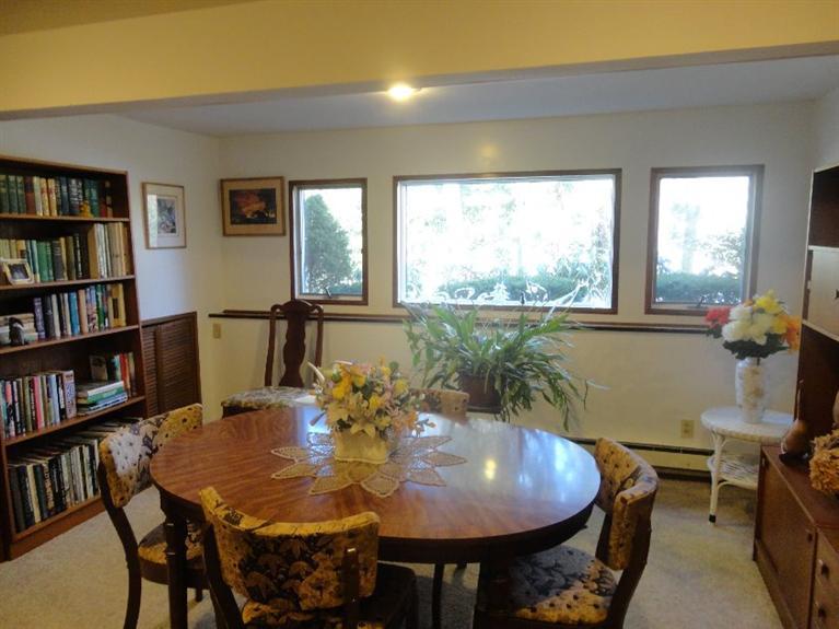 131 Old Kings Road Cotuit, MA 02635 - Photo 20 of 33 a view of a dining room with furniture window and wooden floor