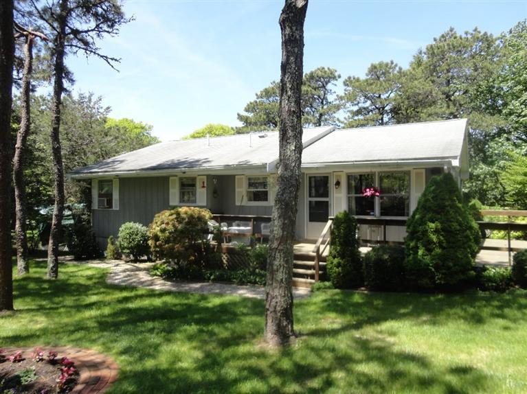131 Old Kings Road Cotuit, MA 02635 - Photo 29 of 33 a view of a house with a yard and garden