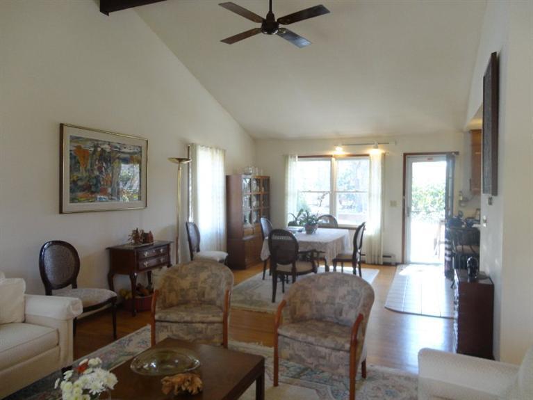 131 Old Kings Road Cotuit, MA 02635 - Photo 10 of 33 a living room with furniture and a large window