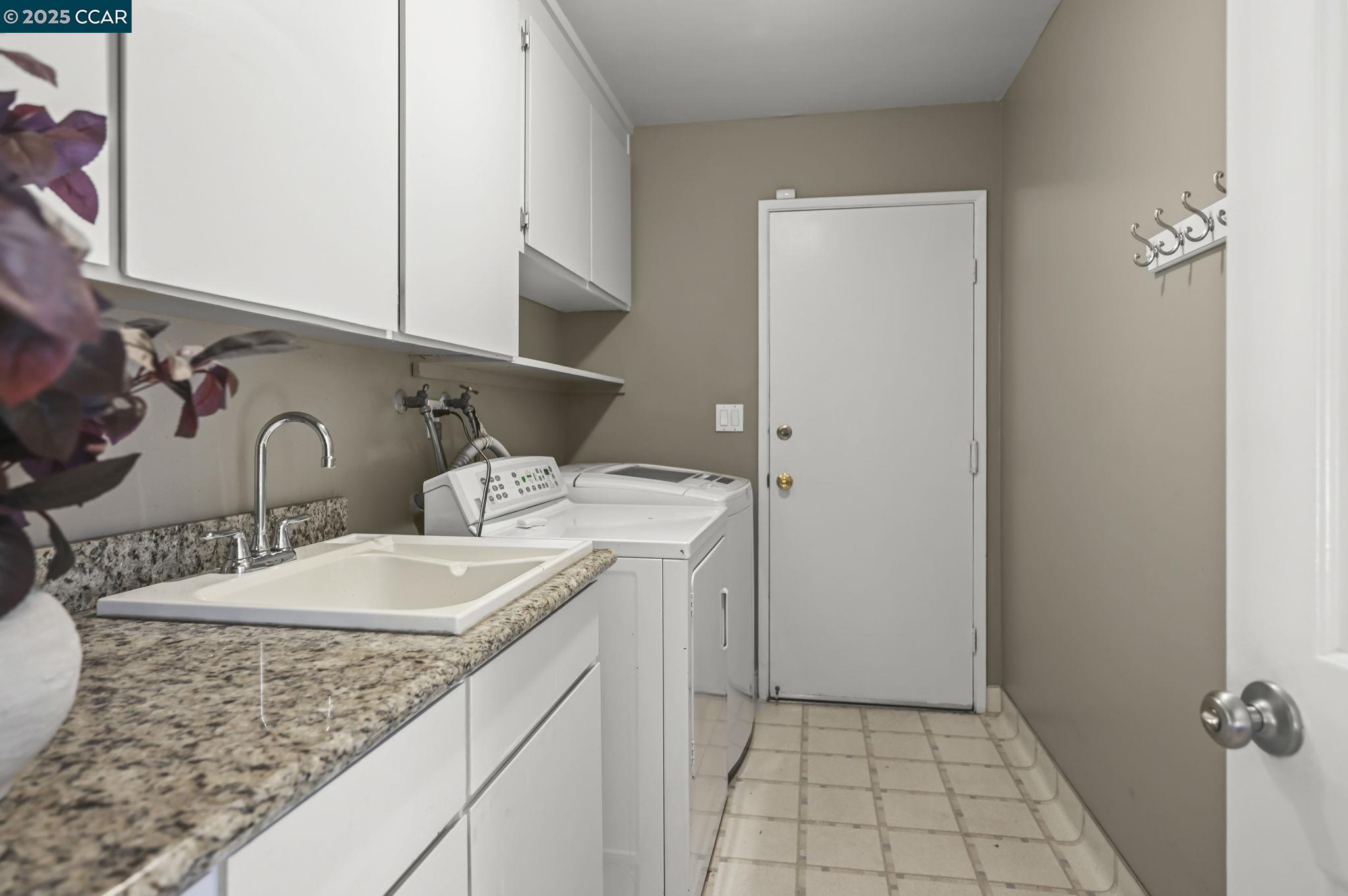 7 Atchinson Stage Road Clayton, CA 94517 - Photo 18 of 37 a bathroom with a granite countertop sink and a mirror