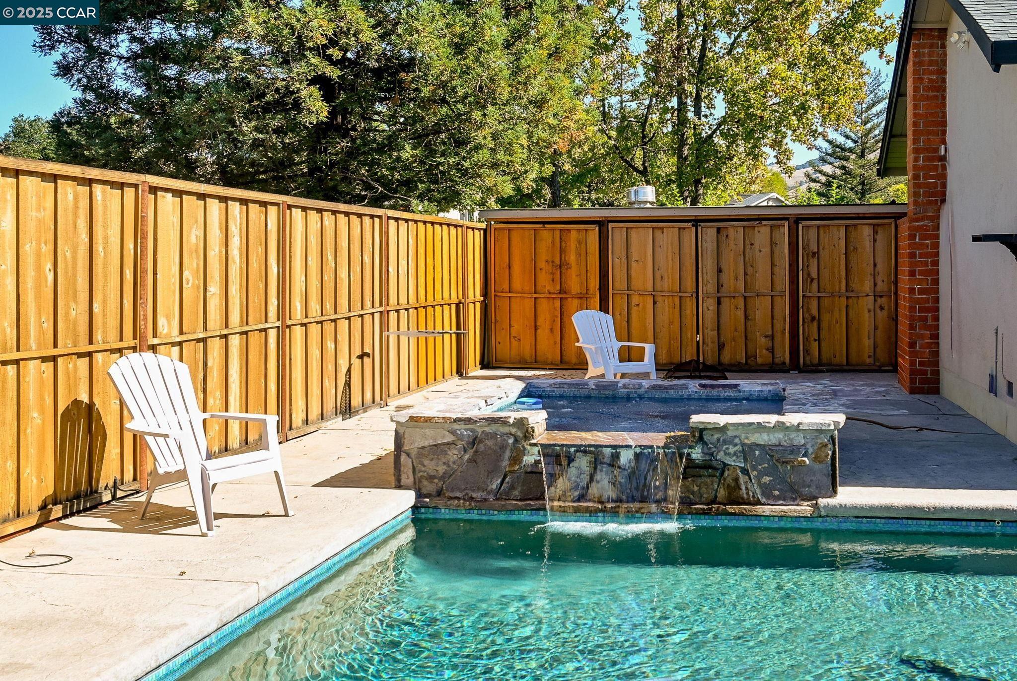 7 Atchinson Stage Road Clayton, CA 94517 - Photo 28 of 37 a view of a back yard with a chair a table and chairs