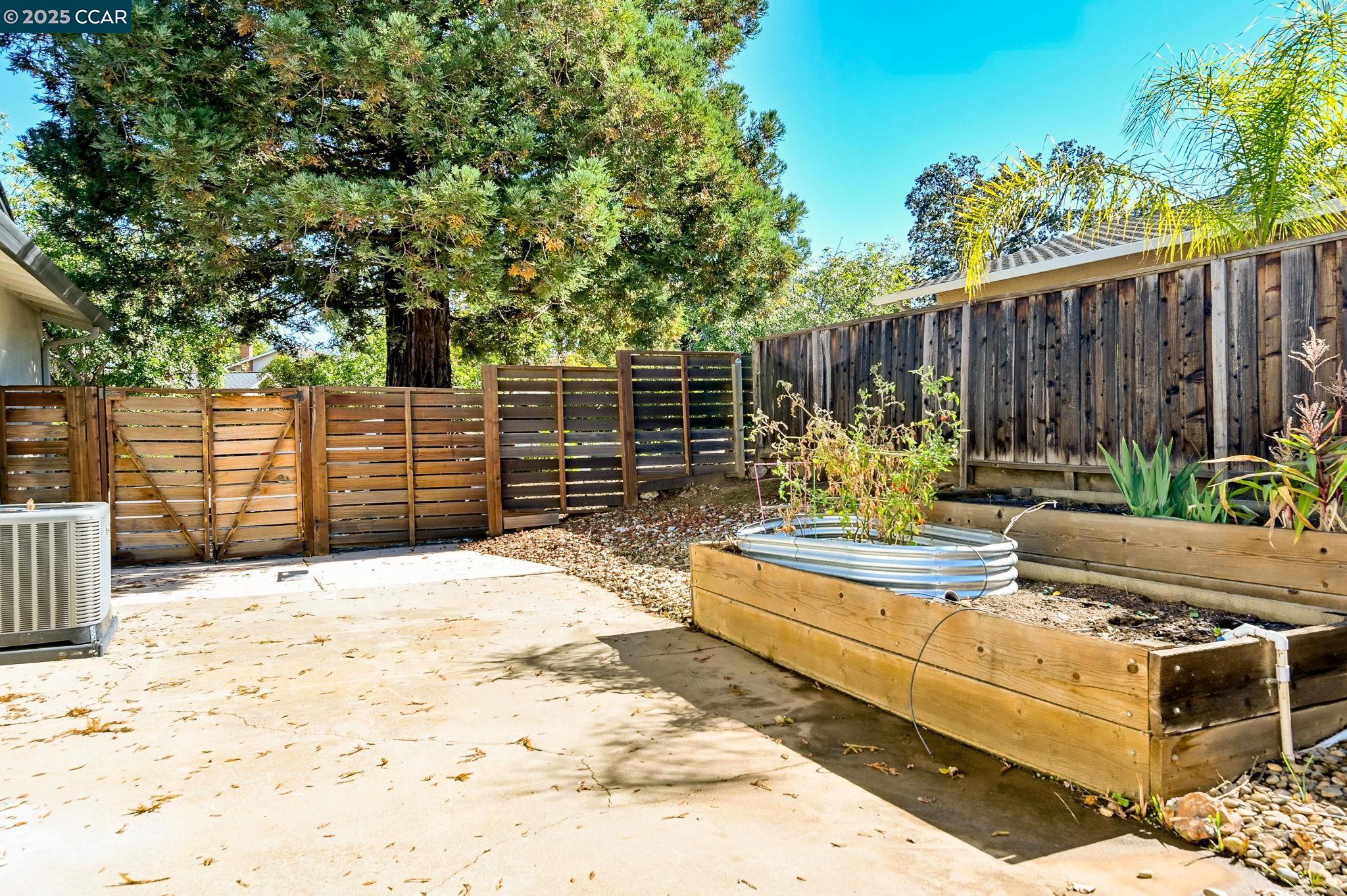7 Atchinson Stage Road Clayton, CA 94517 - Photo 30 of 37 a view of a backyard with a wooden fence