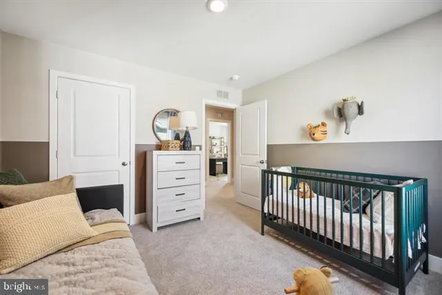 a bedroom with a bed and a dresser