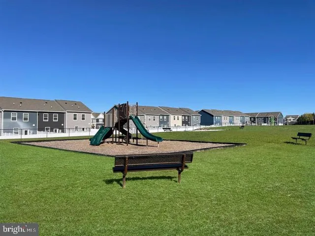 a house view with a sitting space and garden