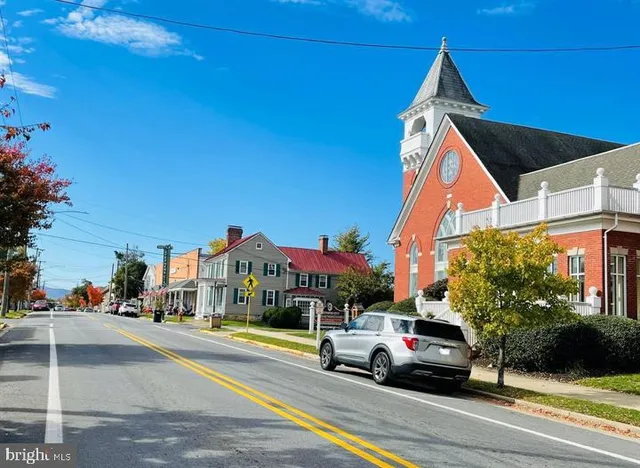 a view of street with parked cars