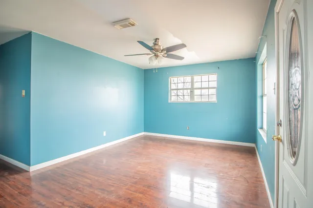 a view of an empty room with a window