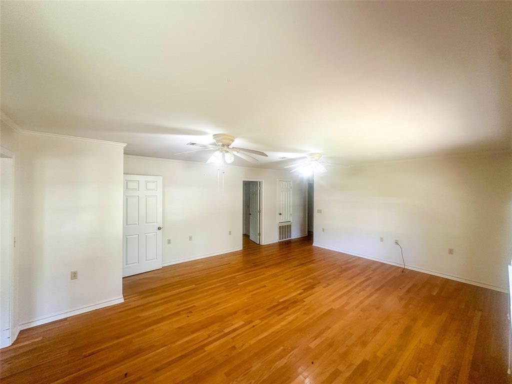894 Percy Burns Road Springhill, LA 71075 - Photo 2 of 8 a view of empty room with wooden floor