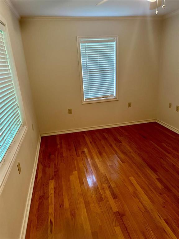 894 Percy Burns Road Springhill, LA 71075 - Photo 5 of 8 a view of an empty room with wooden floor and a window
