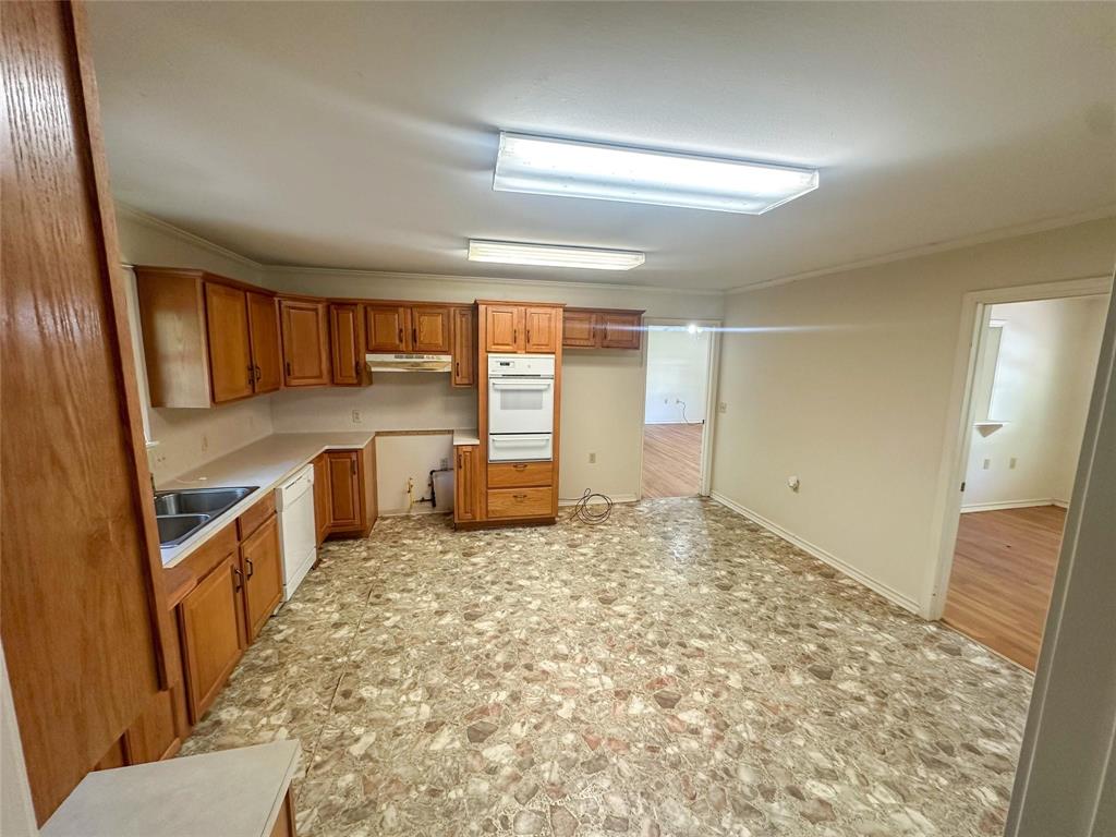894 Percy Burns Road Springhill, LA 71075 - Photo 8 of 8 a view of a kitchen with kitchen island wooden floor and electronic appliances