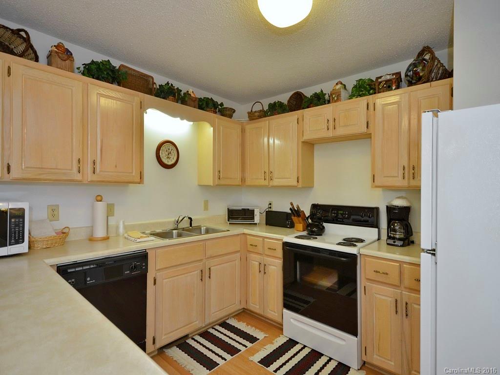 51 Forest Road, Unit 51 Canton, NC 28716 - Photo 6 of 14 a kitchen with a sink a stove and cabinets