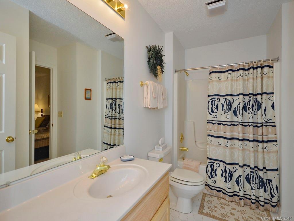 51 Forest Road, Unit 51 Canton, NC 28716 - Photo 8 of 14 a bathroom with a sink toilet and shower