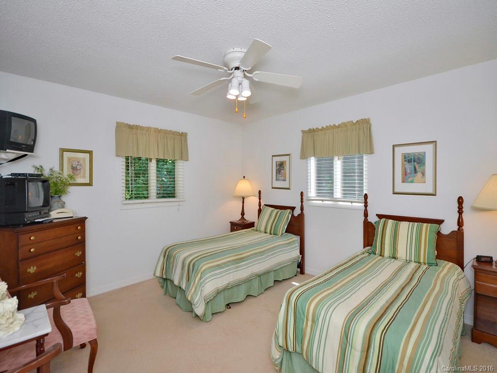 51 Forest Road, Unit 51 Canton, NC 28716 - Photo 9 of 14 a bedroom with two beds and a dresser