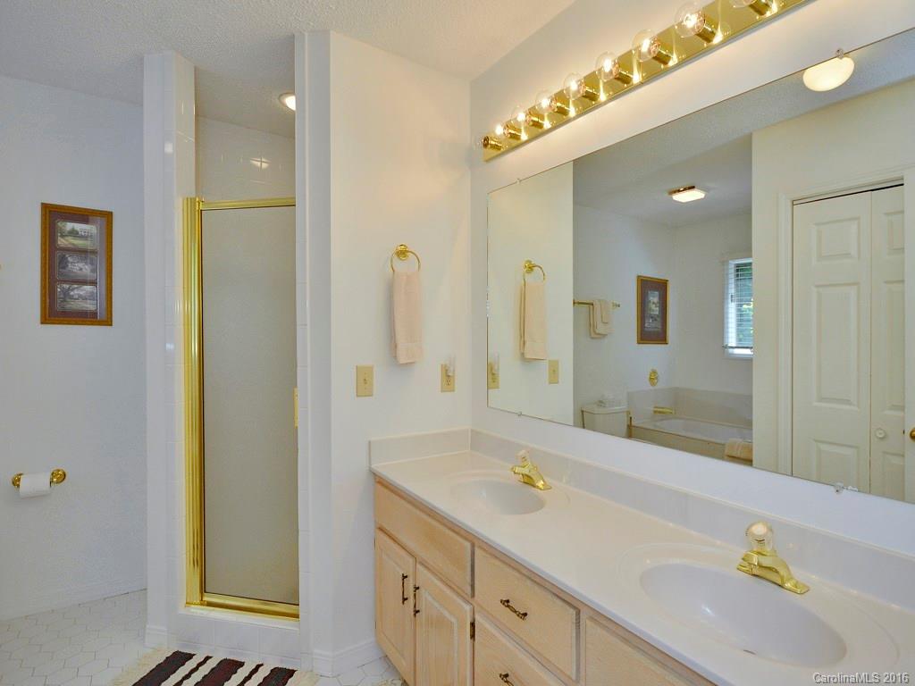51 Forest Road, Unit 51 Canton, NC 28716 - Photo 10 of 14 a bathroom with a sink and a mirror