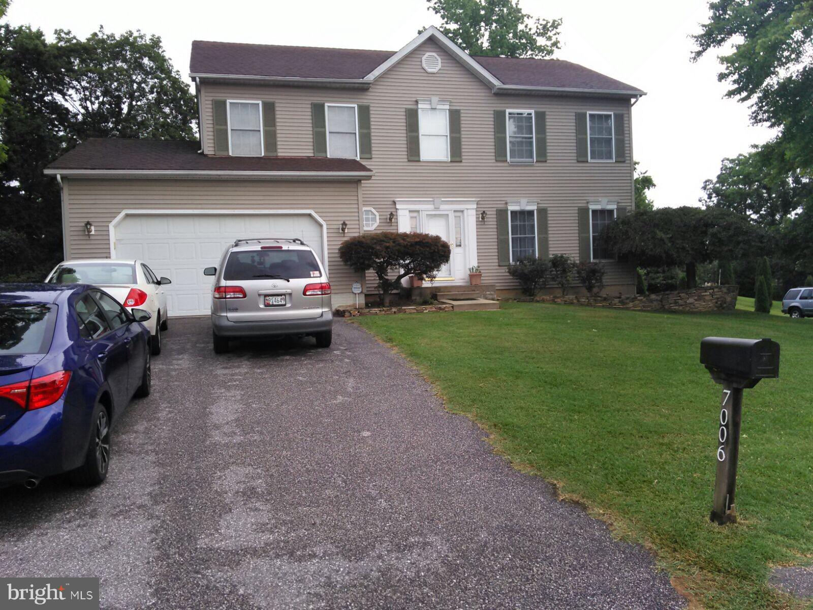 7006 Pinecrest Road Baltimore, MD 21228 - Photo 1 of 30 a front view of a house with garden