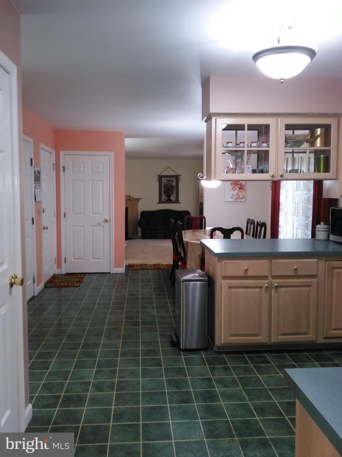 7006 Pinecrest Road Baltimore, MD 21228 - Photo 12 of 30 a kitchen with granite countertop a sink stove and cabinets