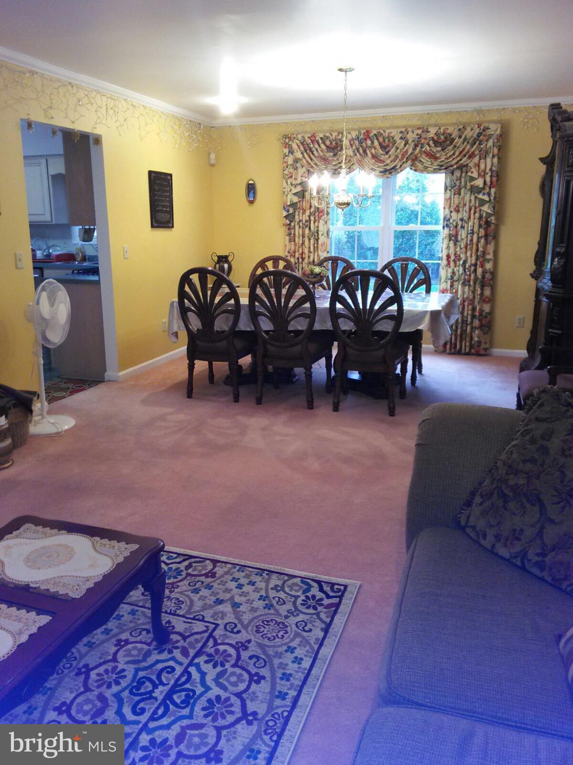 7006 Pinecrest Road Baltimore, MD 21228 - Photo 13 of 30 a living room with furniture a rug and a chandelier