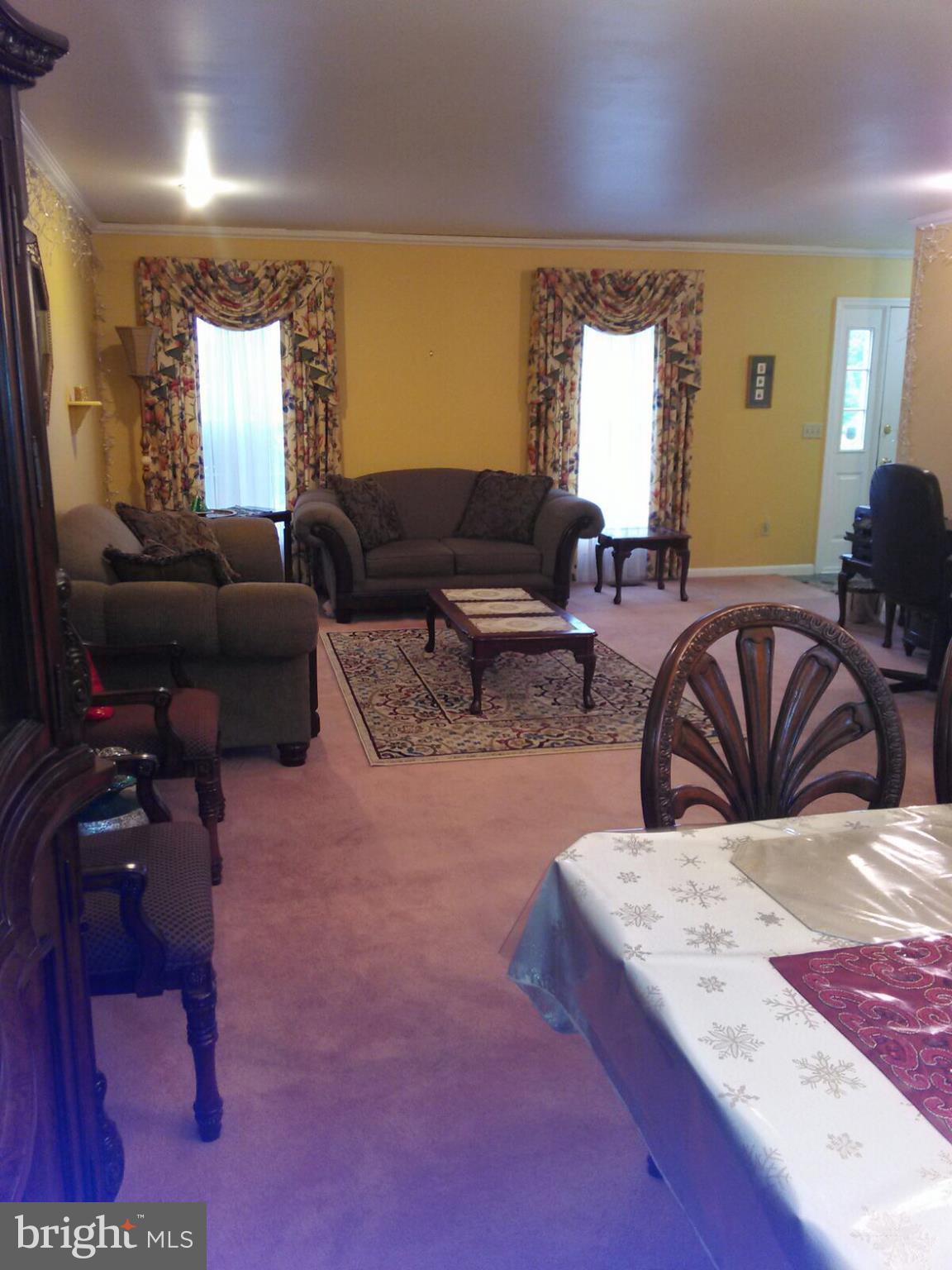 7006 Pinecrest Road Baltimore, MD 21228 - Photo 15 of 30 a living room with furniture and a large window