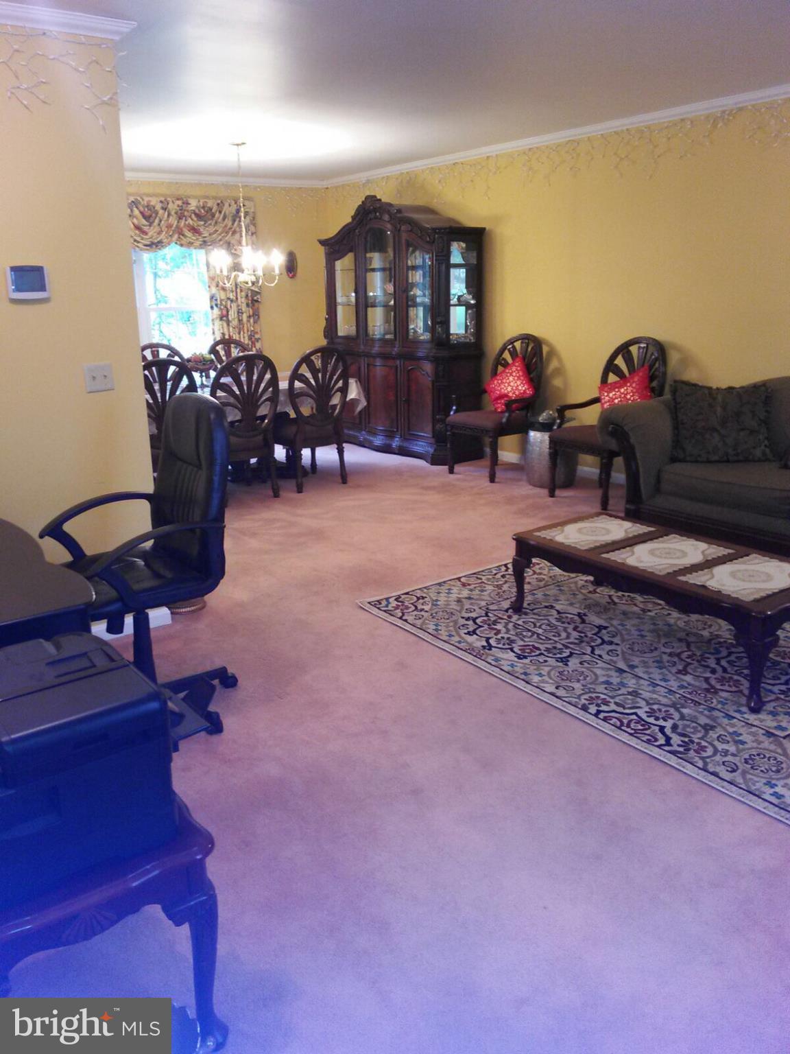 7006 Pinecrest Road Baltimore, MD 21228 - Photo 17 of 30 a living room with furniture chess table and a large window