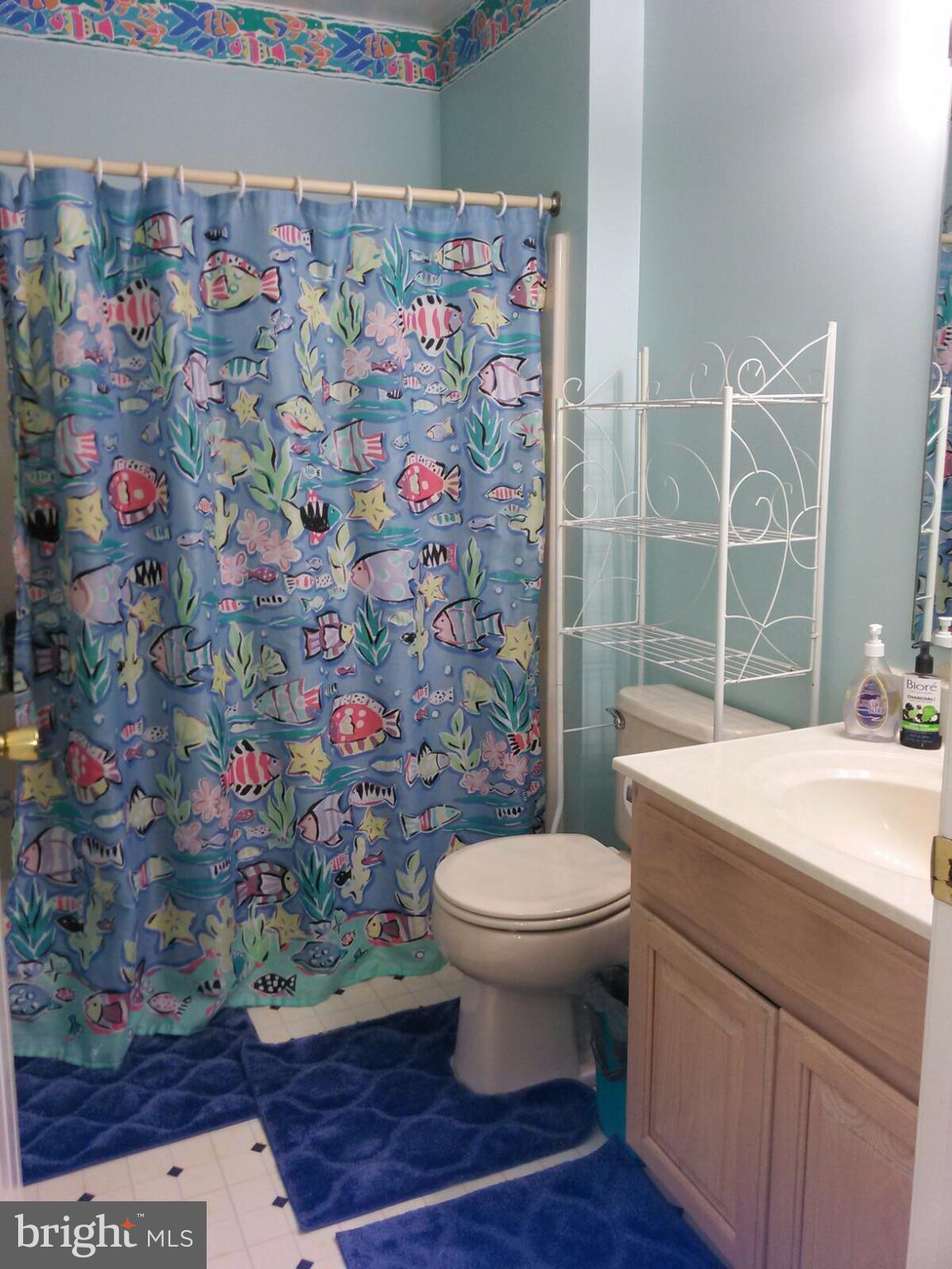 7006 Pinecrest Road Baltimore, MD 21228 - Photo 18 of 30 a bathroom with a sink toilet and shower