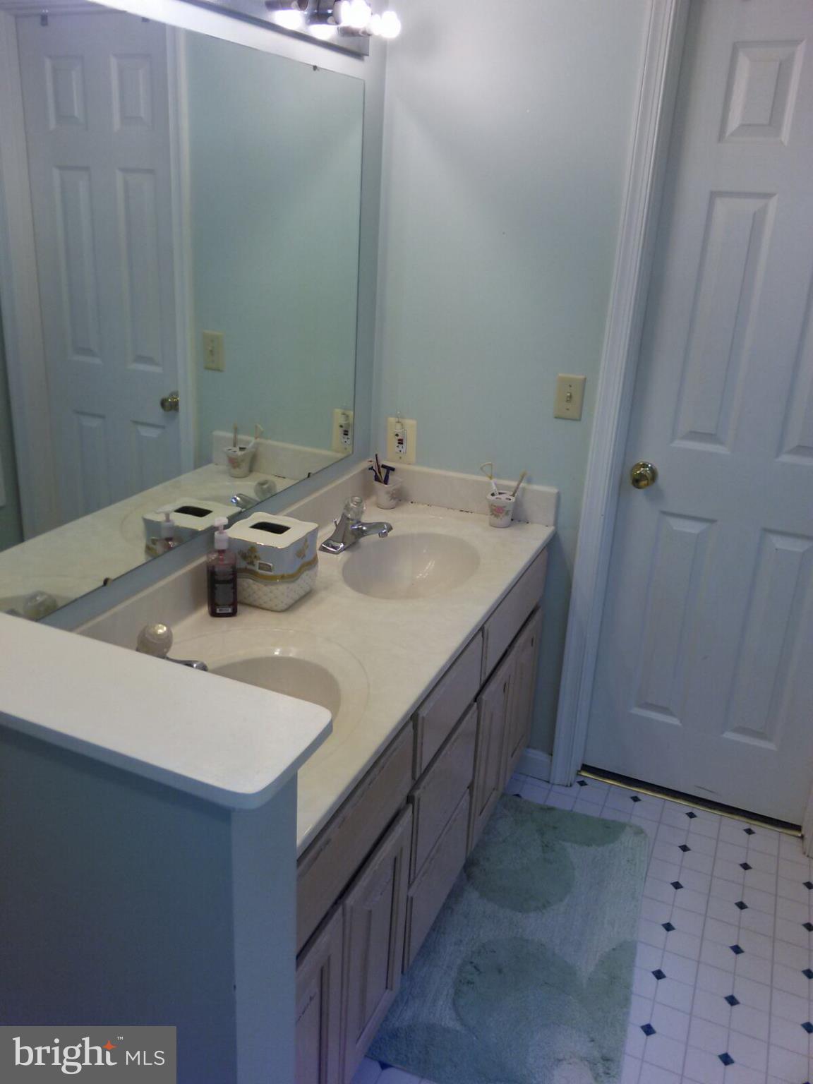 7006 Pinecrest Road Baltimore, MD 21228 - Photo 20 of 30 a bathroom with a sink and a mirror