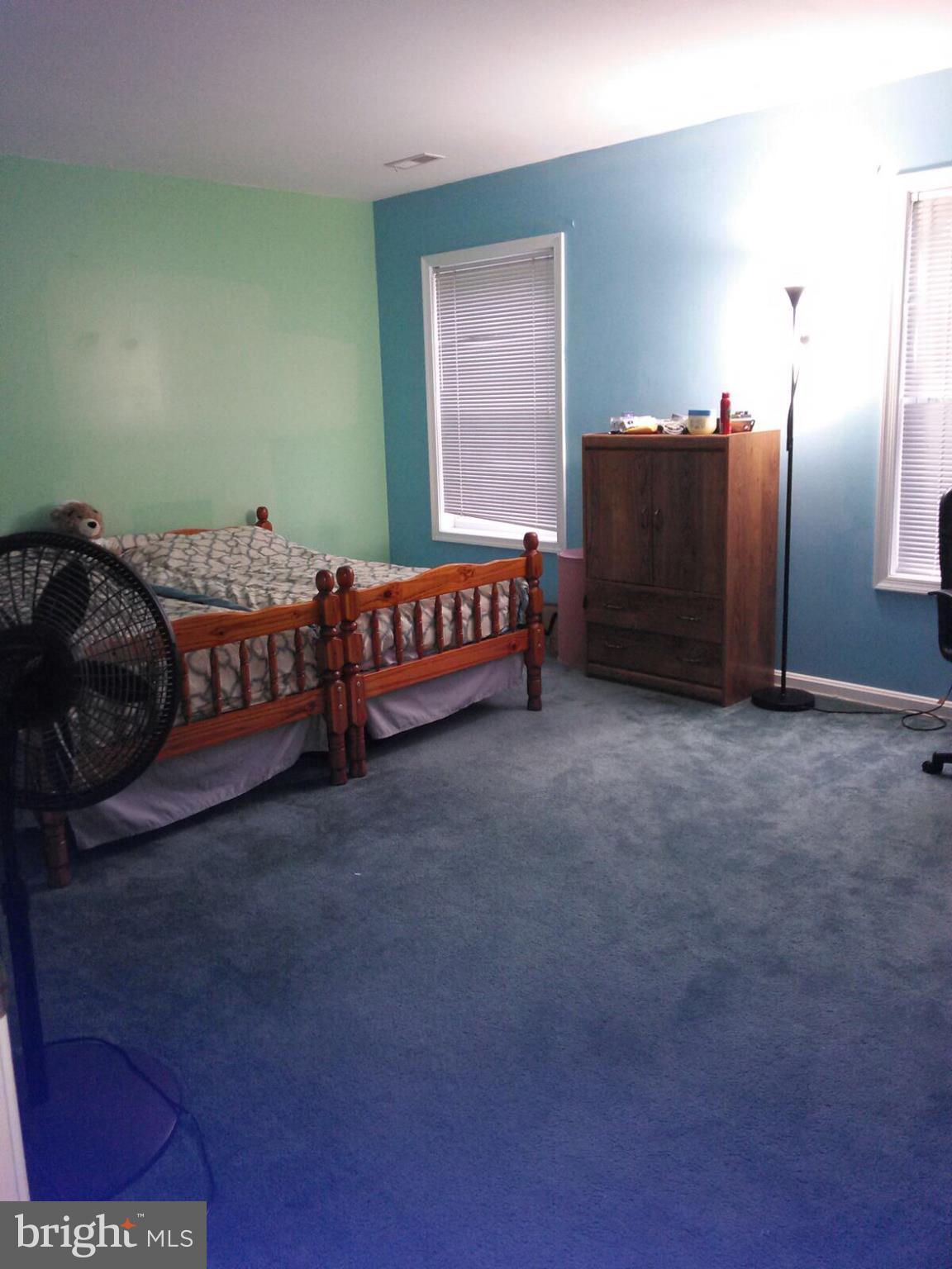 7006 Pinecrest Road Baltimore, MD 21228 - Photo 21 of 30 a bedroom with a bed and a dresser