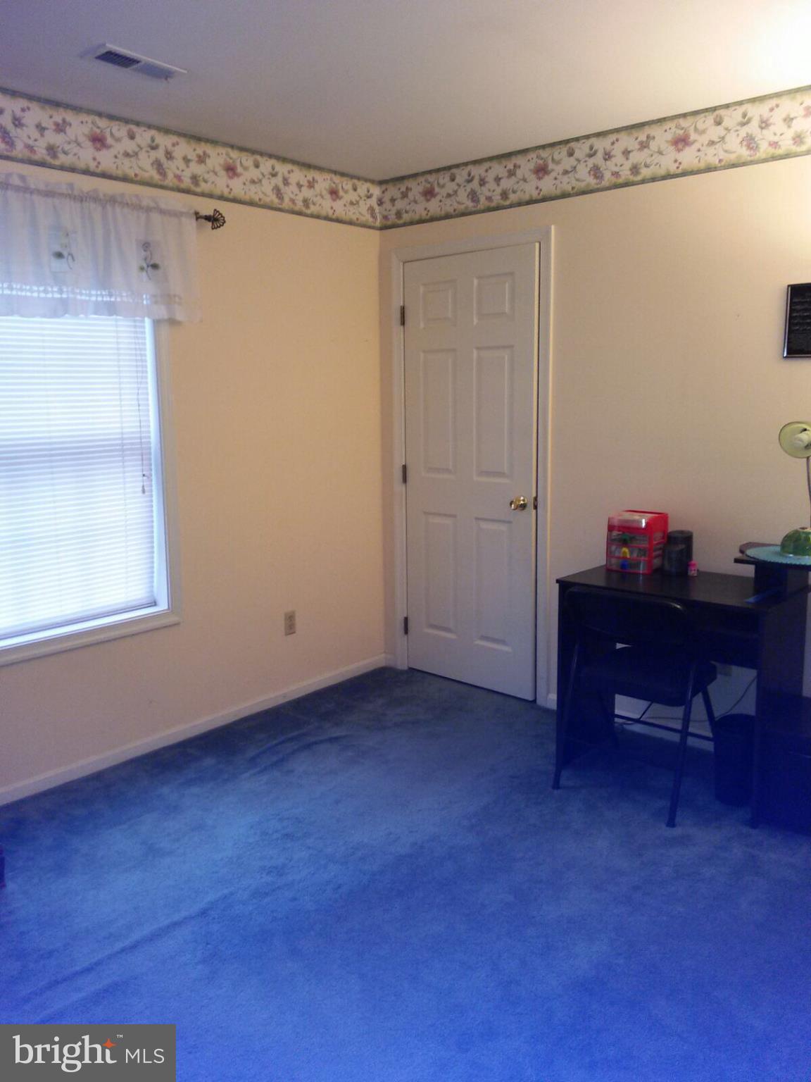 7006 Pinecrest Road Baltimore, MD 21228 - Photo 24 of 30 a view of a workspace with furniture and a potted plant