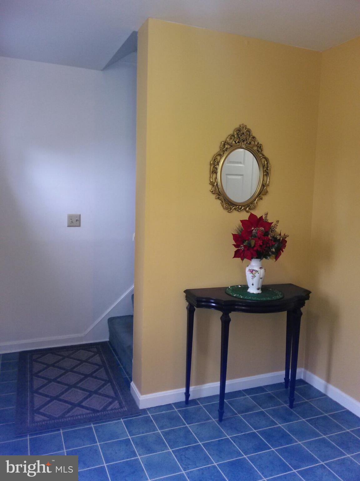 7006 Pinecrest Road Baltimore, MD 21228 - Photo 7 of 30 a view of a room with a table and a potted plant