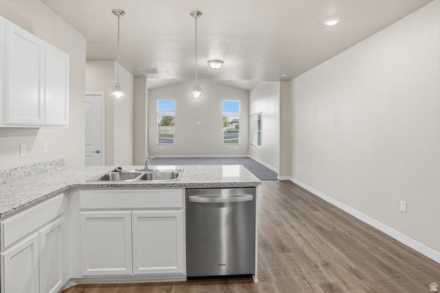 1838 West 300th Street South, Unit B Mapleton, UT 84664 - Photo 11 of 51 Kitchen peninsula featuring a double basin stainless steel sink, stainless steel dishwasher, white shaker cabinetry, and light-toned speckled countertops