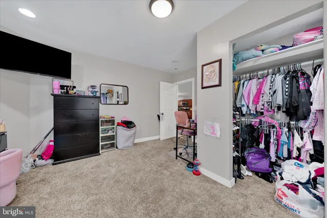 a bathroom with a sink vanity mirror and toilet