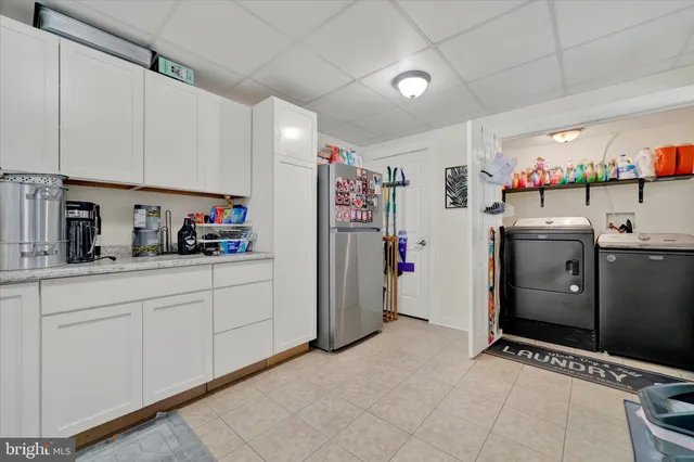 a bed room with a bed and a flat screen tv