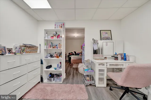 a bedroom with furniture and a gym equipment