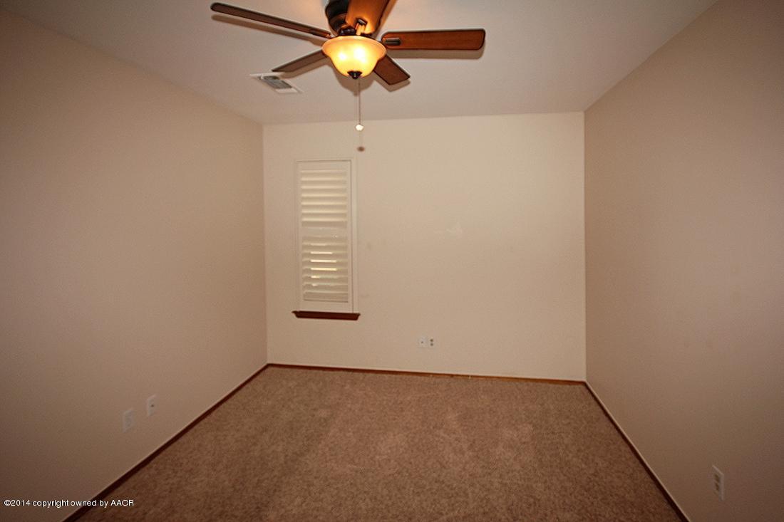 8105 Marni Trail Amarillo, TX 79110 - Photo 18 of 30 an empty room with a window and a fan