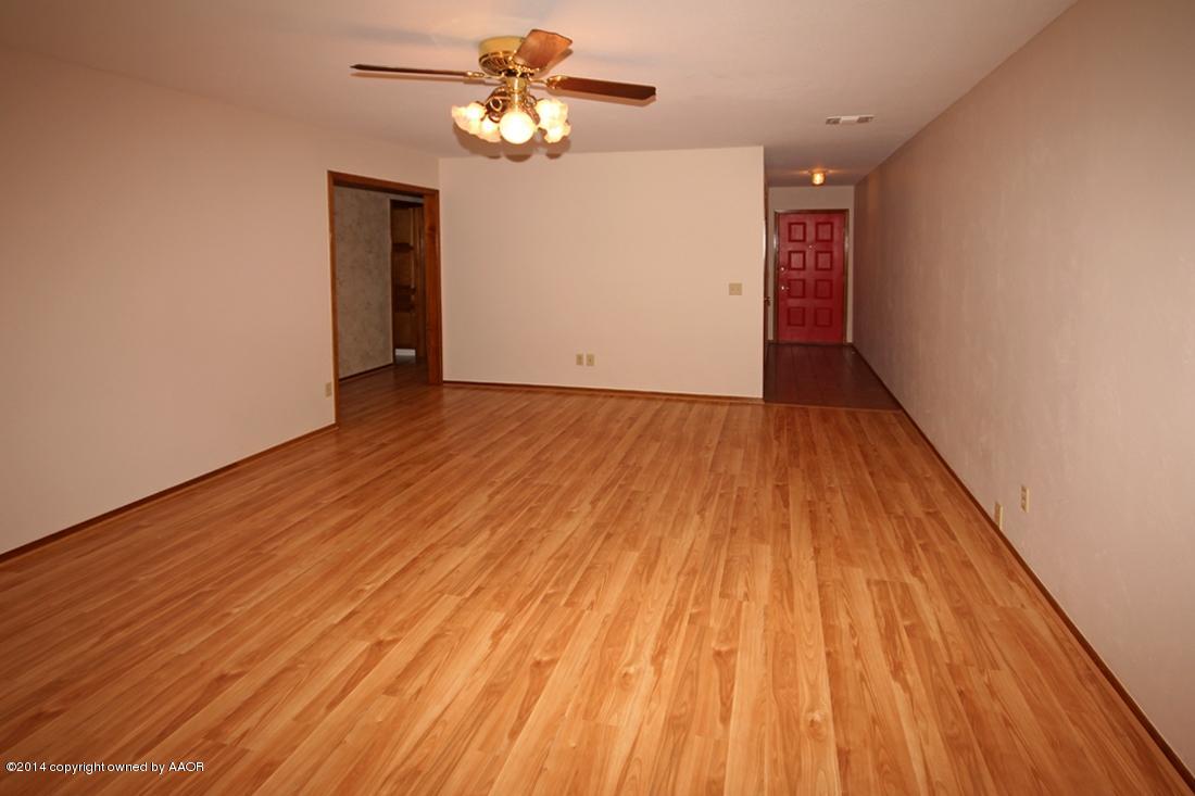 8105 Marni Trail Amarillo, TX 79110 - Photo 5 of 30 wooden floor in an empty room with a window